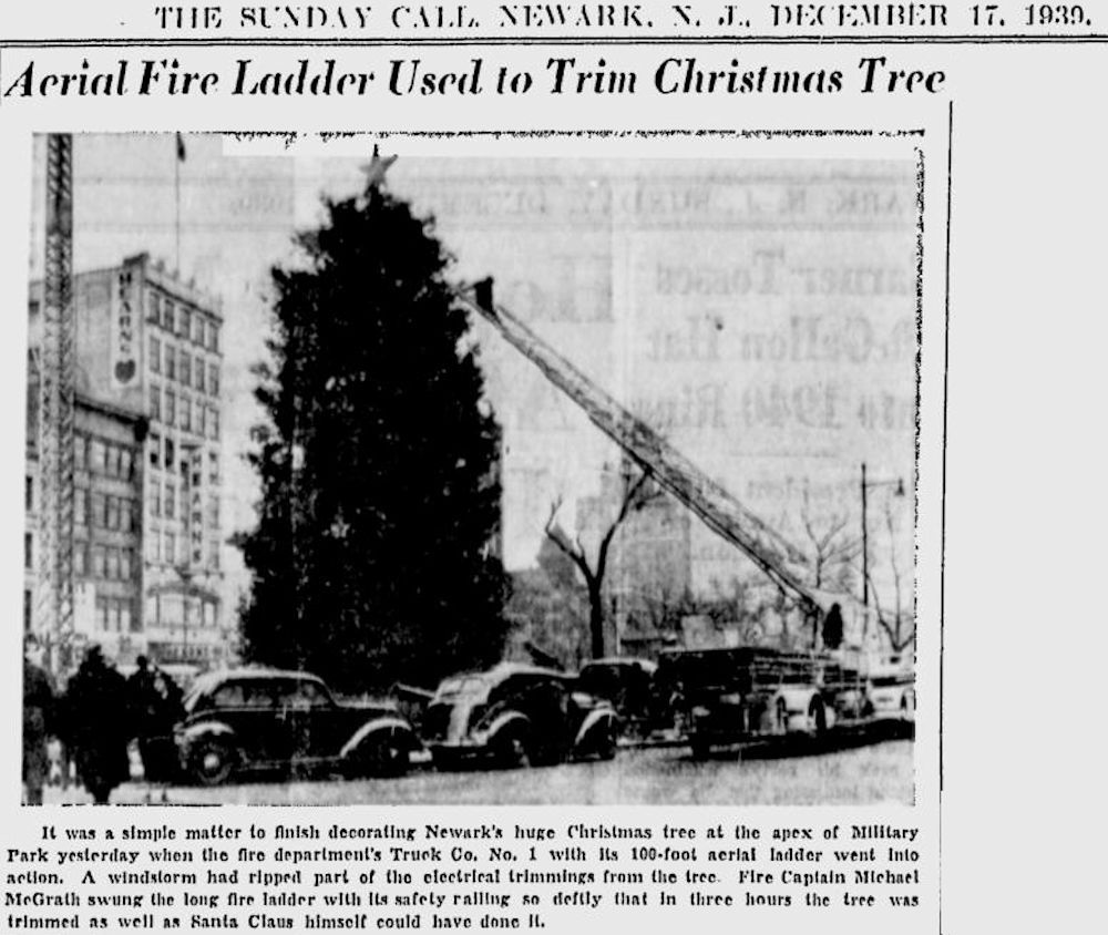 Aerial Fire Ladder used to Trim Christmas Tree
